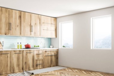 Beyaz İskandinav mutfak köşesi ile mavi Çinili tasarlayın ve beyaz duvarlar, ahşap zemin, ahşap mutfak tezgahı ve dolapları ve sandalye ile bir tablo. 3D render alay