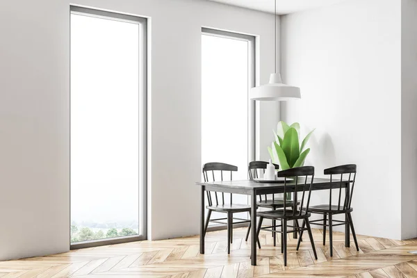 White Scandinavian style dining room interior with a wooden floor, a black table with chairs and loft windows. Side view. 3d rendering mock up
