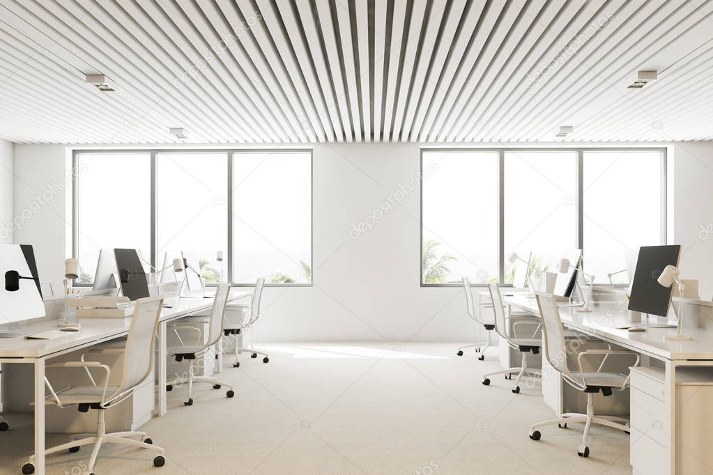 White wall open plan office interior with a white floor, loft windows and rows of computer tables. 3d rendering mock up