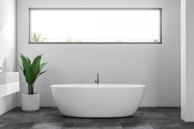 Beyaz duvarları, kiremitli bir siyah zemin, beyaz bir küvet ve bir lavabo ile lüks banyo iç. Dar yatay pencere. İskandinav tarzı. 3D render