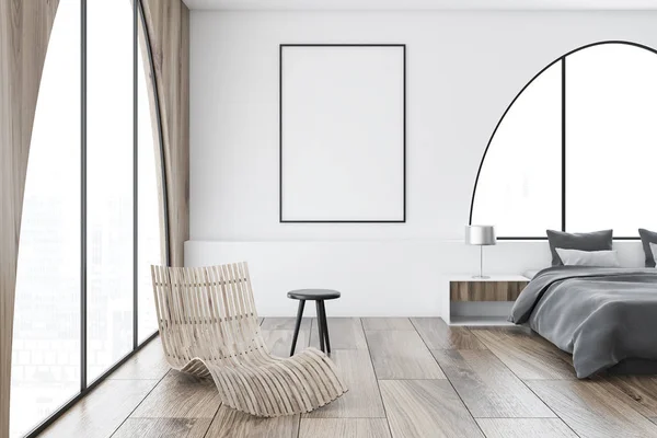 Master bedroom interior with white and wooden walls, a gray master bed and a deck chair standing the arched window. A vertical poster frame. 3d rendering mock up