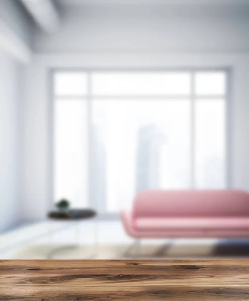 灰色阁楼客厅内部有一个混凝土地板 一个粉红色的沙发和一张茶几在后面 渲染模糊 — 图库照片