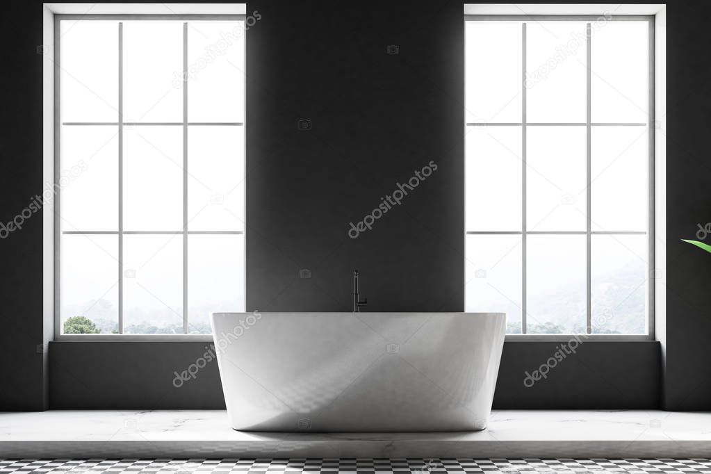 Original bathtub standing in a bathroom interior with a concrete floor, loft windows and dark gray walls. 3d rendering mock up