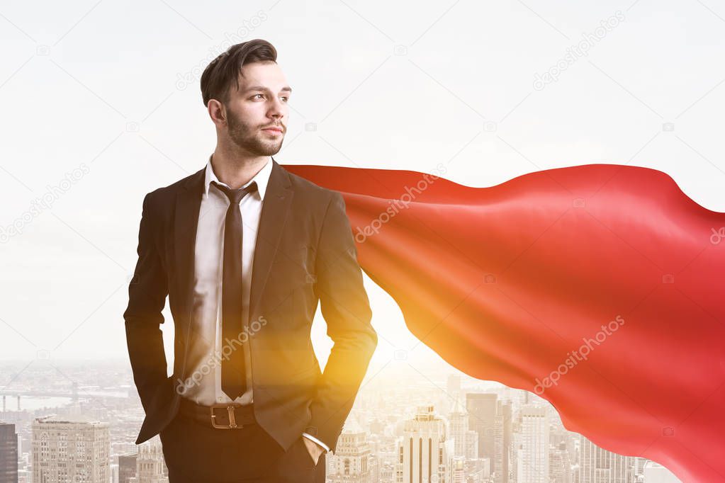 Confident and successful businessman wearing a suit with a tie and a red cape standing against a morning cityscape. Young and daring. 3d rendering mock up toned image