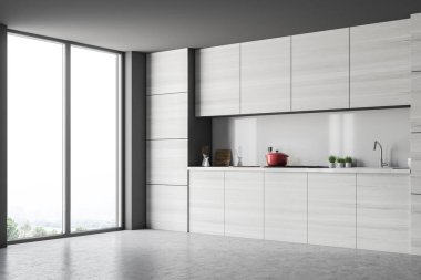 Gri mutfak köşesi ile mutfak tezgahı ve çatı pencere eşiği. Bir beton zemin ve gri duvarlar. 3D render alay