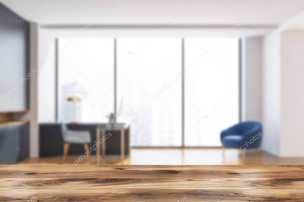Manager office interior with dark gray walls, loft windows, a wooden floor and a stylish computer table. Side view 3d rendering mock up blurred