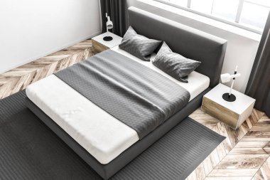 Bir yatak odası beyaz duvarlar, bir halı ile en iyi görünümü bir ahşap zemin ve bir çift kişilik yatak altında büyük bir pencere. 3D render alay