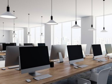 Uzun ahşap masa boş bilgisayar sıra ile modern bir coworking veya bir kolej, üniversite bilgisayar sınıfında bir beton zemin üzerinde duran ekranlar. 3D render alay