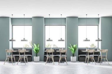 Gri yeşil duvarlar, büyük pencereler, bir beton zemin ve kanepeler ile kare tablolar ile modern café iç. 3D render alay