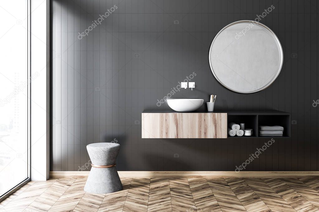 Black tile bathroom interior with a wooden floor and panoramic windows. A round sink with a mirror hanging above it. 3d rendering mock up