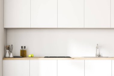 Beyaz mutfak tezgahları bir Ocak, mutfak eşyaları ve onları şişe. Bir dizi üzerinde beyaz odasında asılı dolaplar. Yakın çekim. 3D render alay