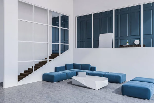 Blue sofas standing around a slate like table in a studio apartment with white walls and a concrete floor. Stairs to the left. Square poster. 3d rendering mock up