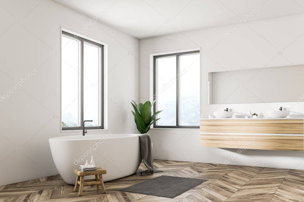 Corner of Scandinavian bathroom interior with white walls, a wooden floor, large windows and a white bathtub standing next to a double sink. 3d rendering mock up