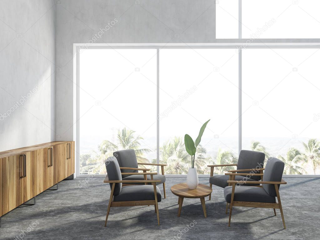 Living room interior with white walls, a concrete floor, panoramic windows with a tropical view and gray armchairs standing around a coffee table. 3d rendering mock up