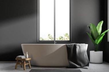 Bu bir gri banyo iç bir beton zemin ile ayakta asılı büyük bir gri havlu ile beyaz küvet. Bir penceredir. 3D render alay