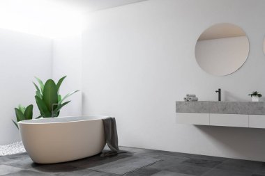 Beyaz duvarları, kiremitli bir zemin, yuvarlak ayna ile bir lavabo ve küvet ile büyük banyo köşesi. 3D render alay