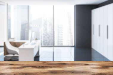 Minimalist Ofis iç siyah tuğla duvarlar, gri karo zemin, bilgisayar masası ve yatay bir poster. Yan görünümü. 3D render sahte bulanıklık kadar