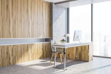 Ahşap ve beton Ofis İşyeri köşe bir beton zemin ve bilgisayar masalı. Duvarın yanında çekmeceli ahşap bir dizi. 3D render alay