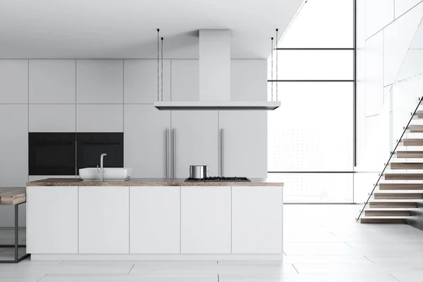 Modern kitchen interior with white countertops and cupboards, and a white floor. A staircase. 3d rendering mock up