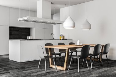 Beyaz duvar köşesi ile karanlık bir ahşap zemin, beyaz odaları ve tezgah ve lavabo ile bir ada mutfak ve yemek odası. Sandalye bir masa. 3D render alay