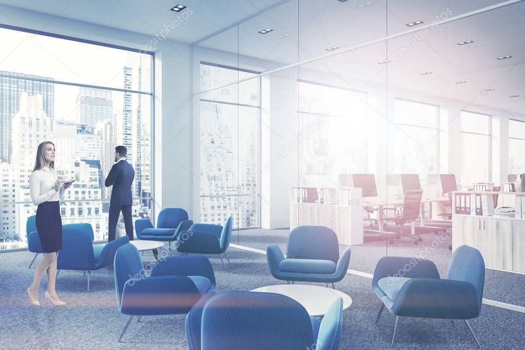 Business people in modern company waiting room interior with soft blue armchairs standing next to round coffee tables on a gray carpet. 3d rendering mock up toned image