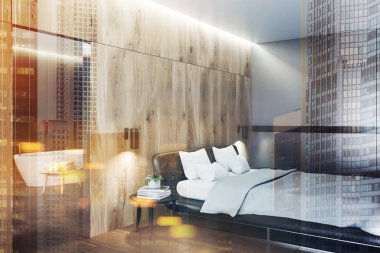 Modern yatak odası ahşap duvarlar ve zemin, bir deri karyola ve Kitaplar ile yuvarlak bir masanın köşesinde. Arka planda bir banyo. 3D render sahte tonlu görüntü çift pozlama şehir kadar