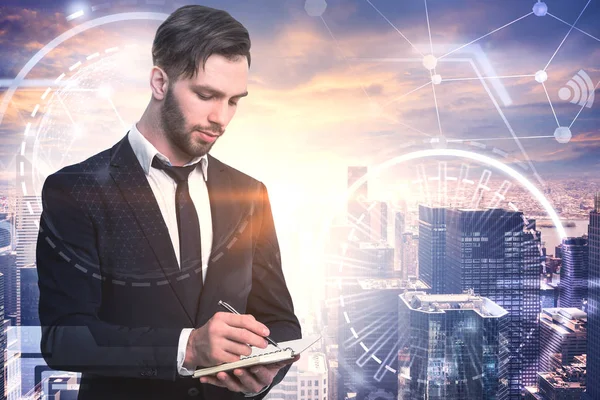 Bearded Young Businessman Writing Copybook Futuristic Glowing Icons Abstract Hud — Stock Photo, Image