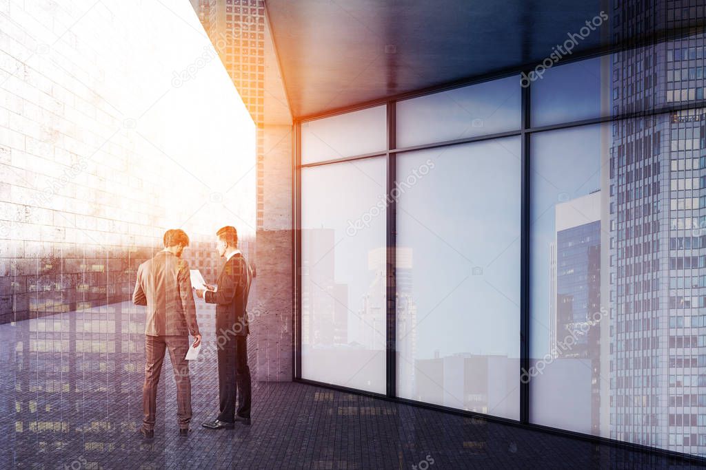 Two businessmen talking over concrete business building exterior with a white wall. Sunny summer day. Architecture and business concept. 3d rendering mock up toned image double exposure city
