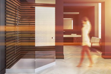 İskandinav tarzı banyo iç Gri duvarlar, beyaz bir ahşap zemin, bir lavabo büyük bir ayna ve bir kanepe ile kadın. Cam kapı duş. 3D render sahte tonlu görüntü bulanıklığı kadar