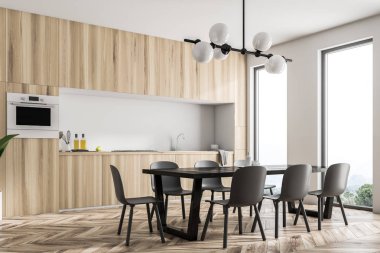 Modern beyaz duvar mutfak köşe panoramik pencerelere, ahşap zemin ve yerleşik aletleri ile mutfak tezgahı ile. Uzun siyah masa sandalye ile. 3D render alay