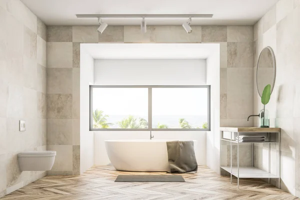 Bathroom interior with beige tile walls, a wooden floor, a bathtub under a large window, a sink and a toilet. 3d rendering — Stock Image Bathroom Interior Beige Tile Walls Wooden Floor Bathtub Large Window Stock Image