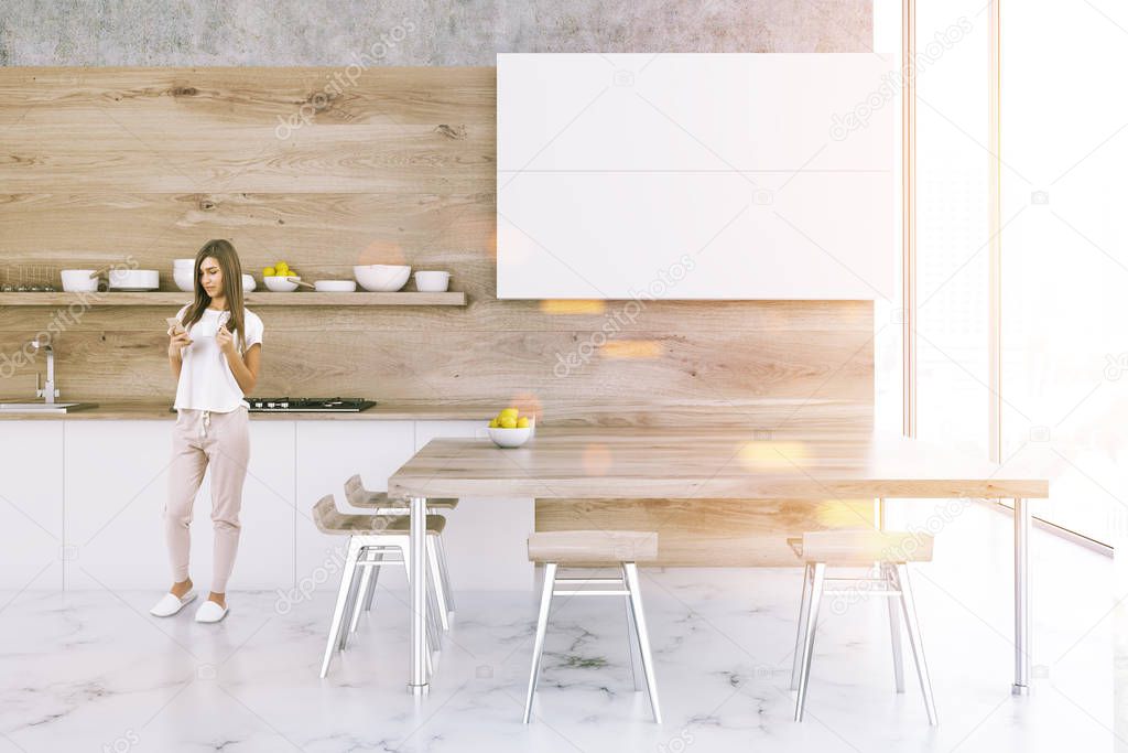 White and wooden kitchen interior with a marble floor, white cupboards and a table with chairs standing around it. Front view. A woman. 3d rendering mock up toned image