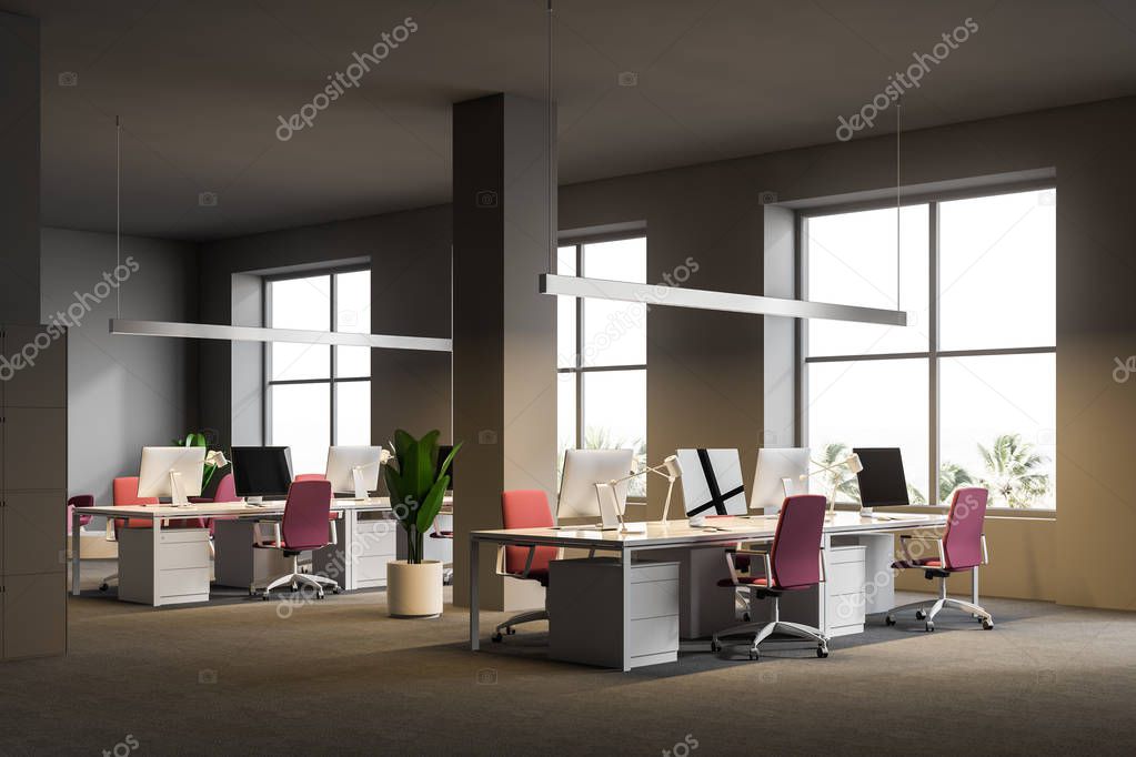 Open plan office corner with gray walls, a carpet on the floor, white computer tables with pink chairs and windows with a tropical view. 3d rendering mock up