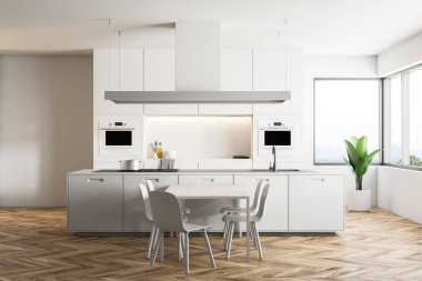 İç beyaz duvarlar, ahşap zemin, büyük pencereler, beyaz ada ve mutfak tezgahı ile modern mutfak ve yemek odası masa sandalye ile. 3D render alay