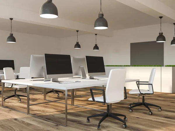 Office of startup company with white walls, wooden floor, rows of white computer tables and a mock up horizontal picture on wall. Flower beds and stylish ceiling lamps. 3d rendering