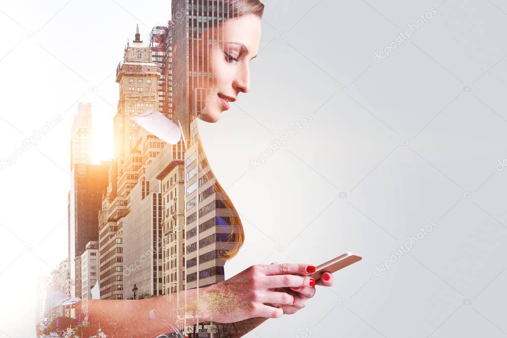 Side view of attractive smiling businesswoman looking at her smartphone screen in a morning city. Business lifestyle concept. Toned image double exposure copy space