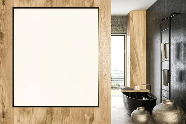 Vertical mock up banner frame hanging on wooden wall of luxury bathroom. A black bathtub, vases and a towel rack. Panoramic window with a mountain view. Marketing and advertising concept. 3d rendering