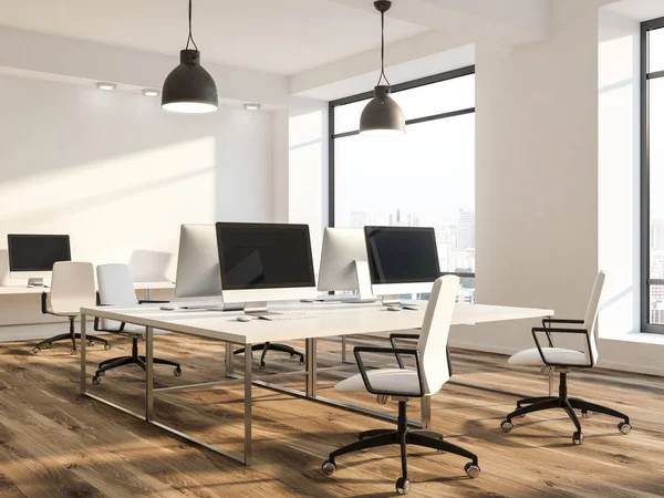 Open space office or computer lab interior perspective with white walls, wooden floor, loft windows and rows of computer tables with white chairs near them. 3d rendering mock up