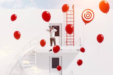 Young businessman with crossbow shooting red baloons standing on white building emergency stairs. Achieving your business goal concept. Toned image double exposure clipart