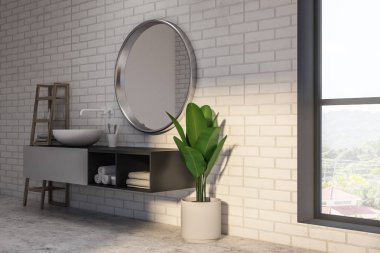 Siyah ve beyaz makyaj birim üzerindeki yuvarlak ayna üzerinde beyaz lavabo duran yuvarlak. Bir beton zemin beyaz tuğla banyo. Saksılı bitki ve raflar. 3D render