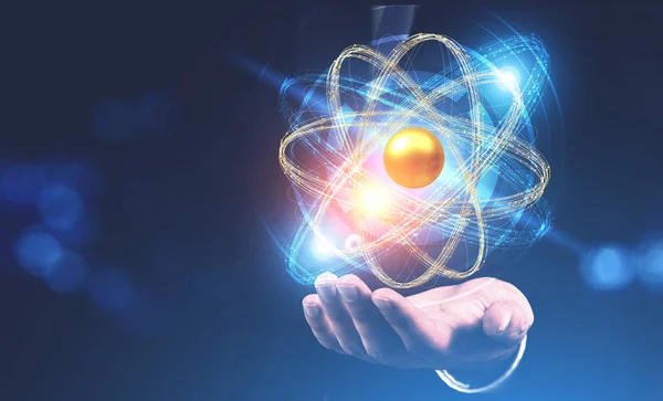 Adam Eliyle Vurgulama Parlayan Altın Mavi Atom Modeli Üzerinde Koyu — Stok fotoğraf