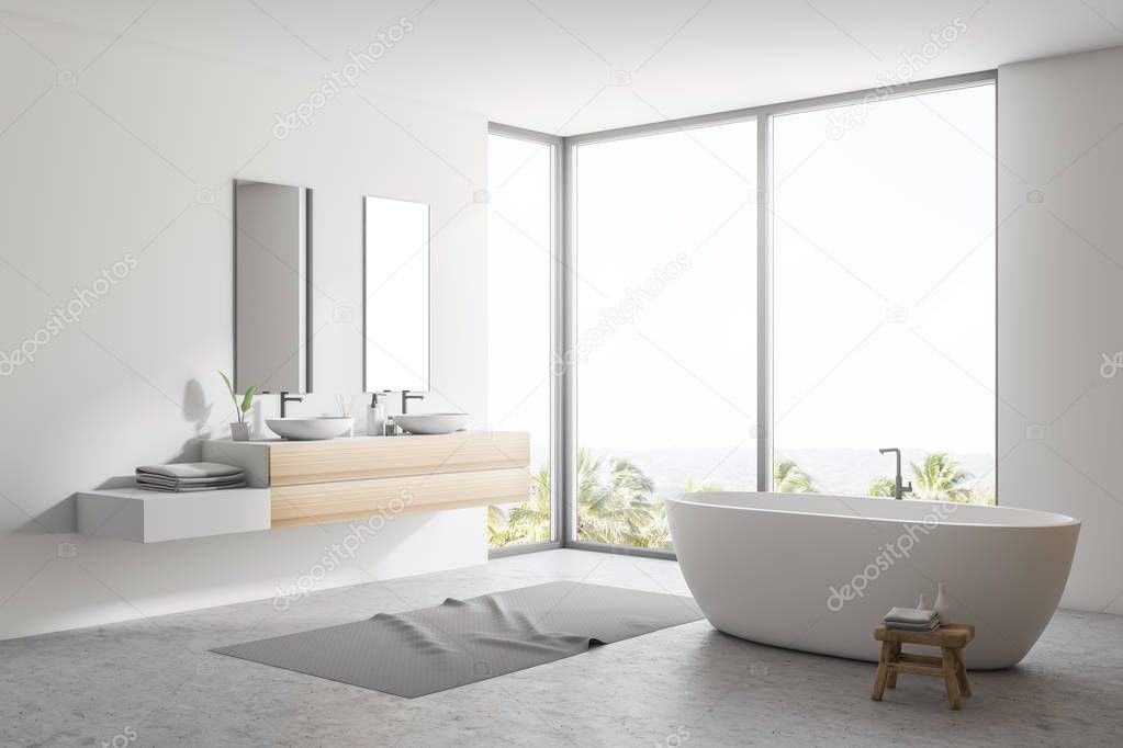 Stylish white bathroom interior with concrete floor, gray rug, window with tropical view, wooden wall, big bathtub, and double sink with vertical mirrors. 3d rendering copy space