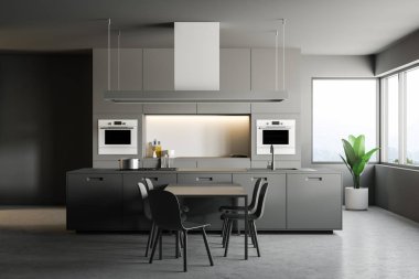 İç Gri duvarlar, beton zemin, ile gri mutfak tezgahı ile şık mutfak aletleri, bir ada ve gri bir masa sandalye ile inşa. 3D render kopya alanı