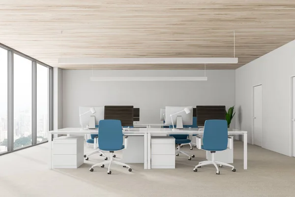 White walls open space office interior with wooden ceiling, rows of computer tables with black screen monitors and blue chairs. 3d rendering copy space