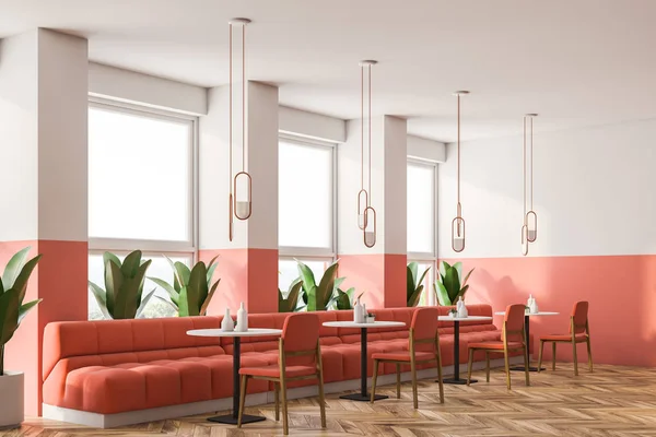 Pink and white loft retro cafe interior with wooden floor, small round tables and pink sofas and chairs. Retro lamps. 3d rendering