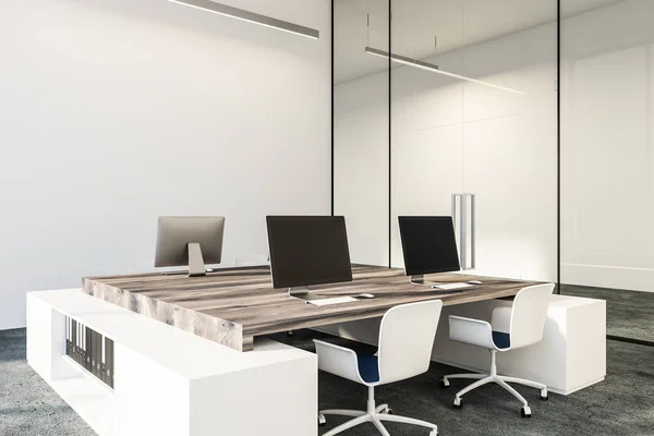 Black computer screens standing on wooden tables in minimalistic white office with concrete floor and loft windows. Side view 3d rendering copy space