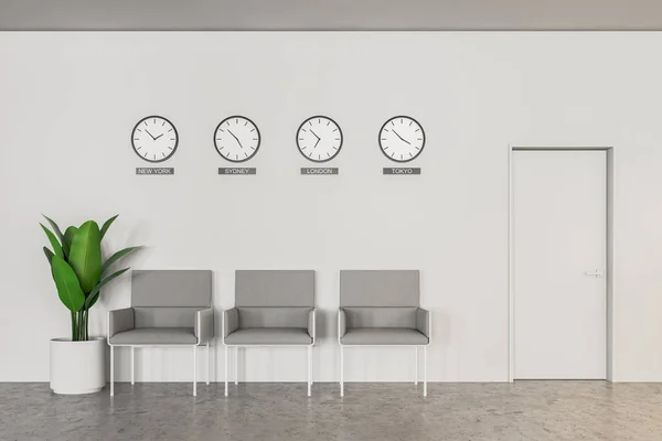 Interior of office or bank waiting area with concrete floor, white walls, row of gray armchairs and clocks with world time. 3d rendering