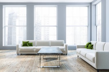 Lüks salon iç Gri duvarlar, ahşap zemin, yeşil yastıkları ile iki beyaz koltuklar ve sehpa ile. 3D render