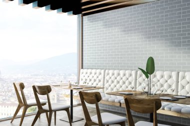 Gri tuğla duvar, beton zemin, beyaz kanepe ve sandalye ile kare tablo ile modern restoran köşesinde. 3D render