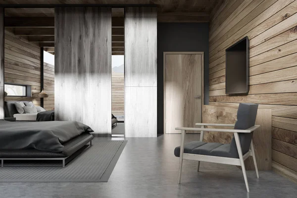 Interior of stylish bedroom with wooden walls, concrete floor, gray master bed and tv set on the wall. 3d rendering